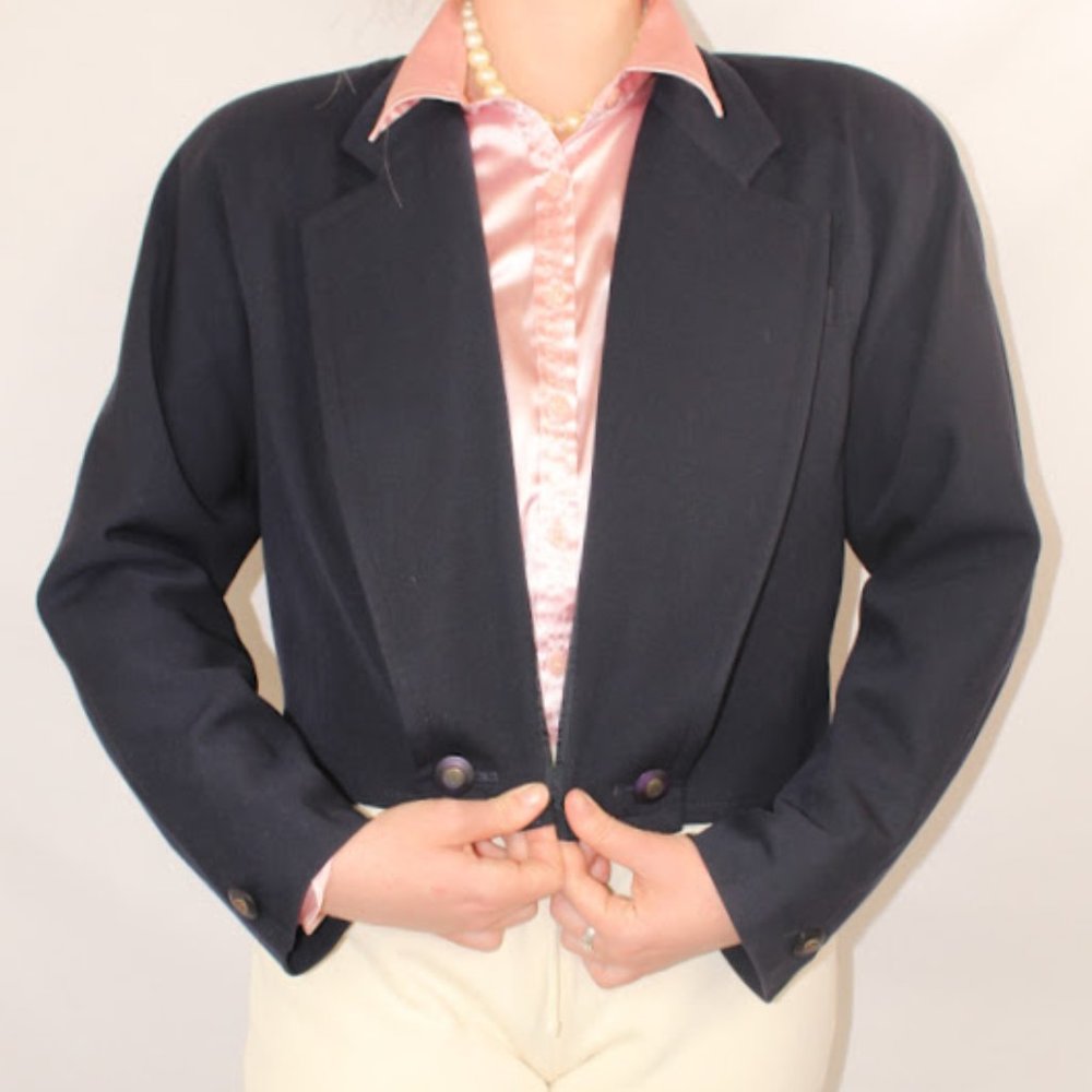 Blazer is in excellent condition. There are small scuff marks on 2 of the button